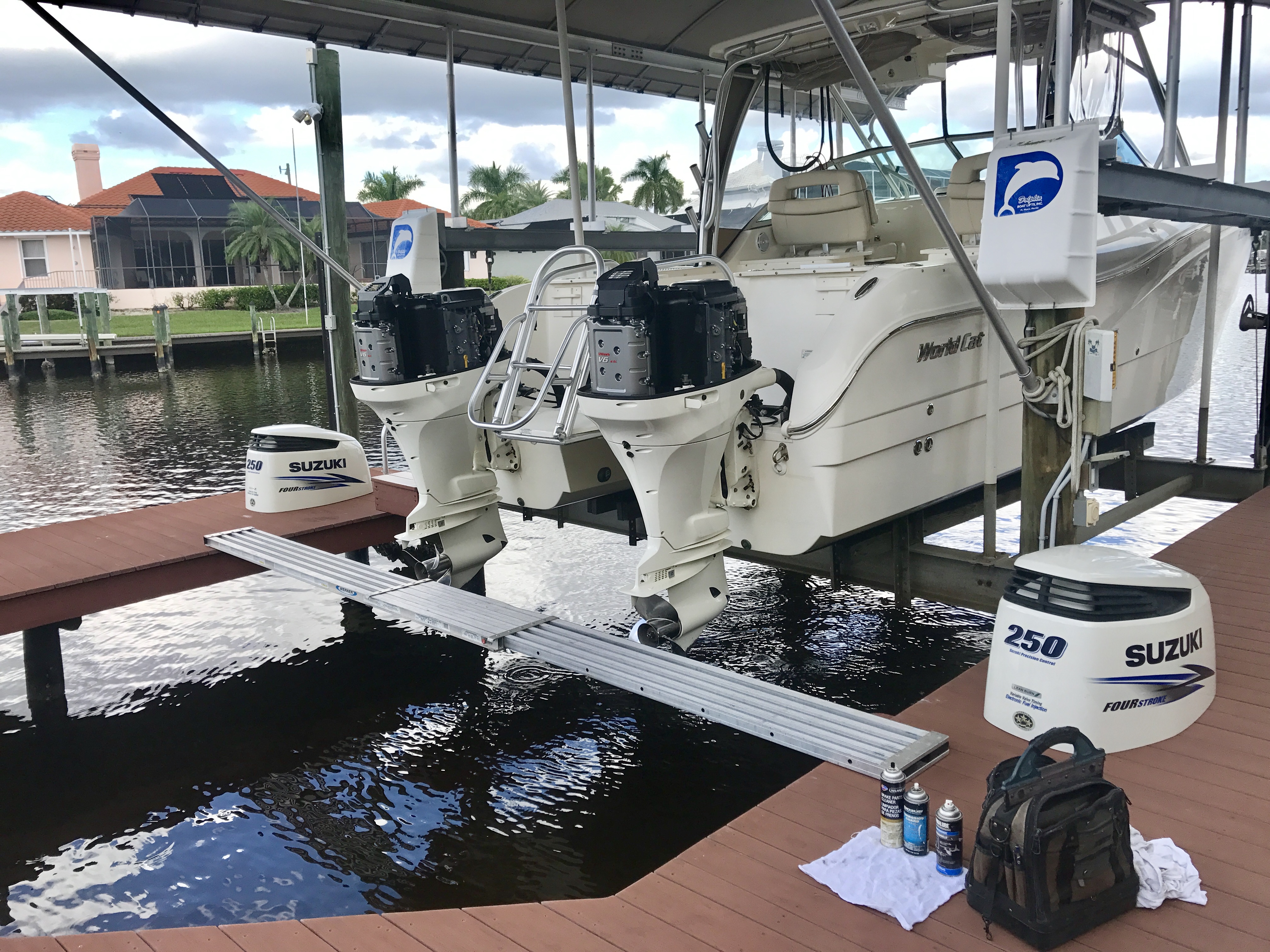 A boat on a lift over a Cape Coral canal